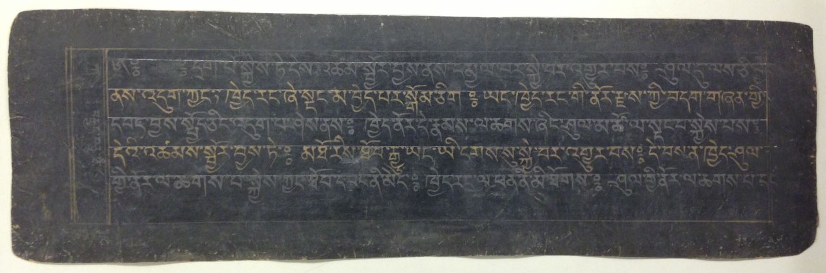 A page from an 18th-century manuscript copy of the Tibetan Book of the Dead. The text is written in alternating gold and silver ink. The blue-black lacquered paper was created by applying a lacquer made of yak-skin glue, animal brains, and soot, which was then burnished to create an appropriate writing surface.   (MSS 14259)
