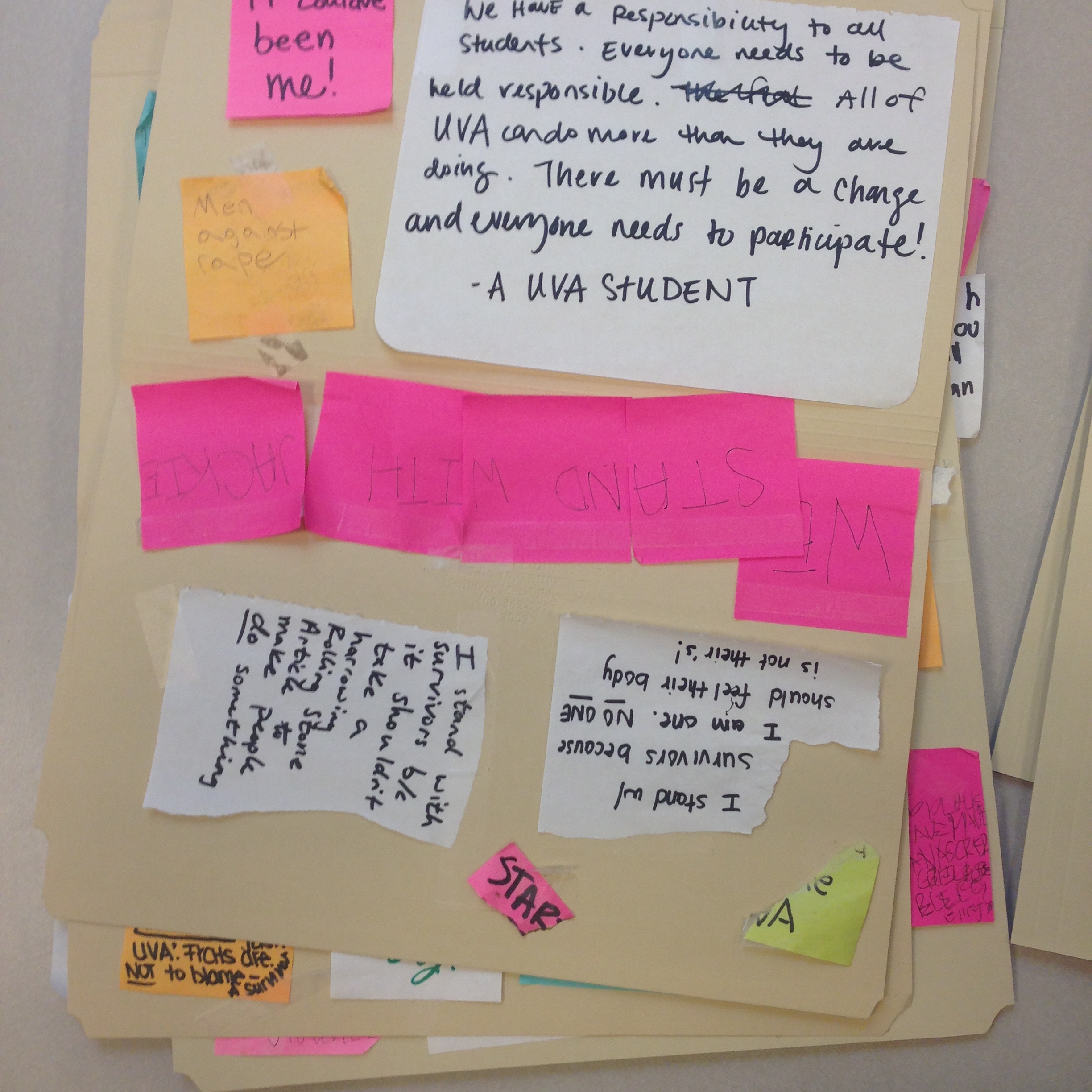 Notes from Peabody Hall door, temporarily housed on archival folders, 10 December 2014. (Photograph by Edward Gaynor)