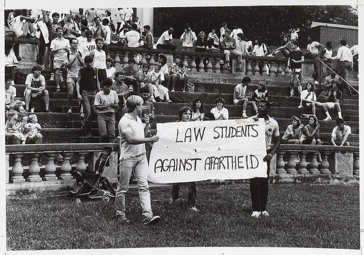 Atcheson Laughlin Hench. Anti-Apartheid Rally. Photograph, 1987 (RG-30/1/10.011) University of Virginia Visual History Collection This photograph, taken in 1987, depicts University of Virginia law students in the McIntire Amphitheatre, peacefully protesting the racially divisive apartheid system in South Africa. Hench, a University professor since 1922, was also a keen chronicler of University life through photography and many of his pictures remain in the University’s Visual History Collection. The apartheid government would begin the process of handover to a democratic system three years later in 1990. 