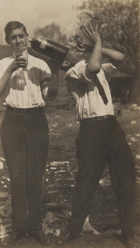 “Guys Drinking.” Hot Foot Society, 1903. (RG-23/46/1.971) University of Virginia Visual History Collection This photograph shows two University of Virginia students drinking alcohol straight from handles. These students were members of a society at the University of Virginia, formally known as the Hot Foot Society. The Hot Foot Society, which began in 1902, was known for its heavy participation in drinking. After their first suspension in 1908, the Hot Foot Society decided to disband in 1911, following a prank which resulted in the expulsion of four members and one-year suspensions for another four members. In 1913, the society reincarnated itself into the IMP Society, which remains active today. 