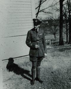 Here Faulkner poses in his uniform with a cigarette.