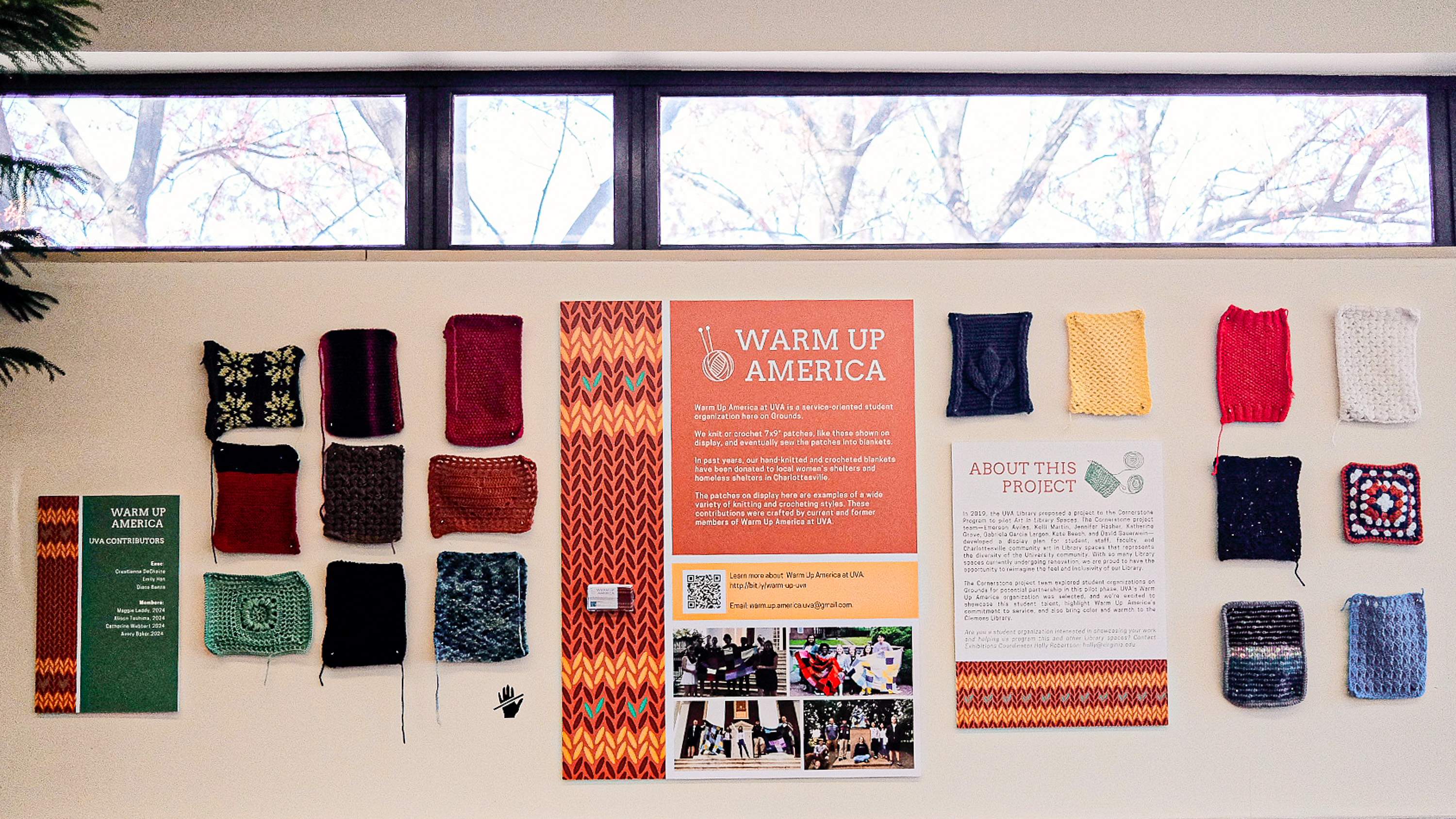 Gallery installation of knit and crochet squares by student organization Warm Up America