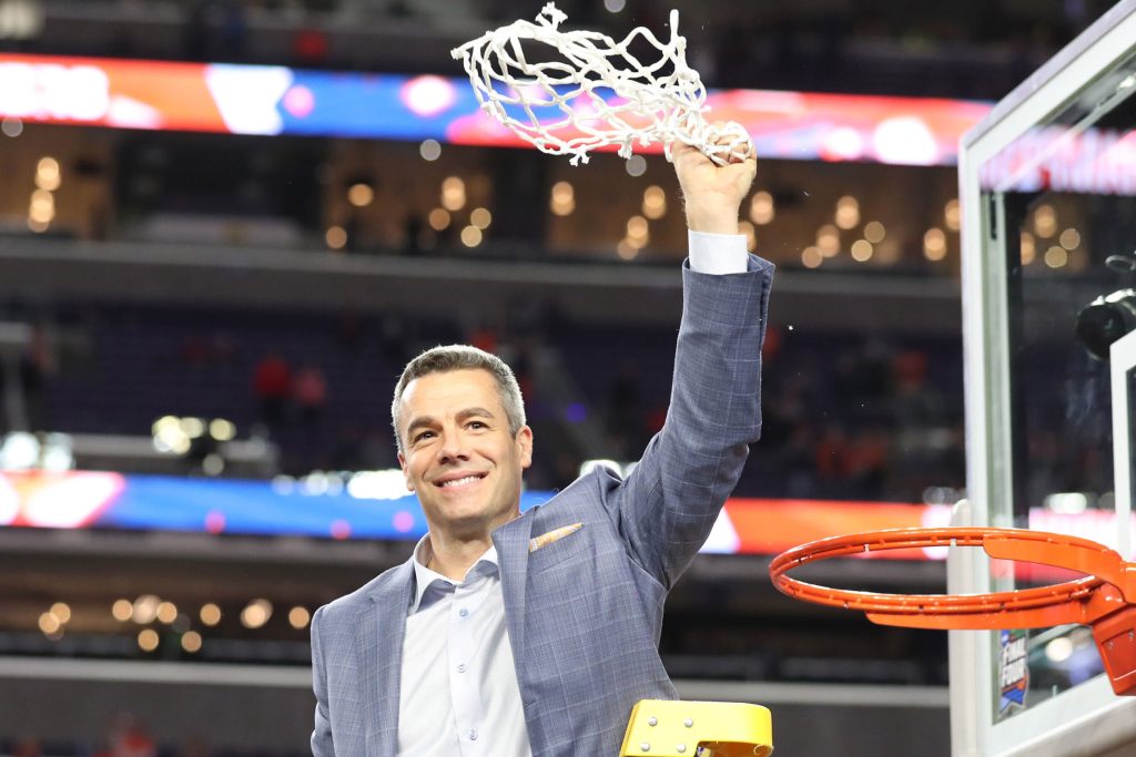 Photograph of Tony Bennett with championship game basketball net.